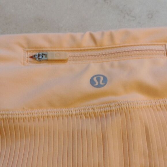 Lululemon Pleat to Street Mid-Rise Skirt Summer Glow light orange pleated 12 - Picture 4 of 14